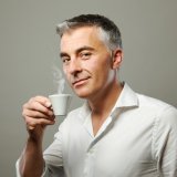 Handsome mature man enjoying a hot drink
